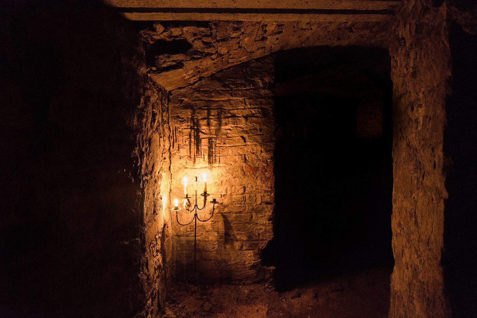 Candlelit chamber inside the Edinburgh Vaults beneath South Bridge