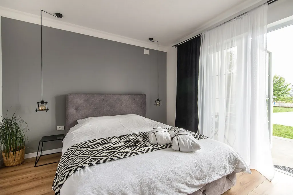 Sleep paralysis vs spiritual presence — a tidy calm bedroom in daylight (Wikimedia Commons)